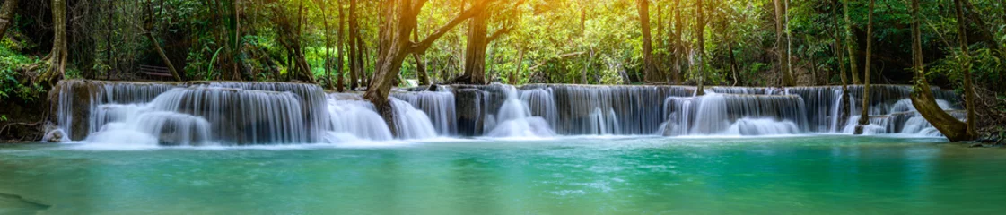 A beautiful waterfall deep in the tropical forest, steep mountain adventure in the rainforest. © Sun13