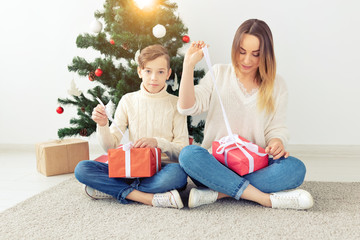 Single parent and holidays concept - Portrait of mother celebrating christmas at home on christmas eve