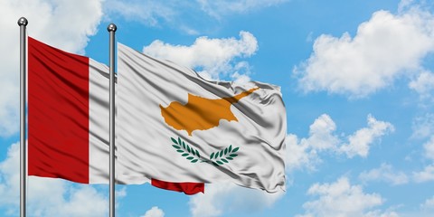 Peru and Cyprus flag waving in the wind against white cloudy blue sky together. Diplomacy concept,...