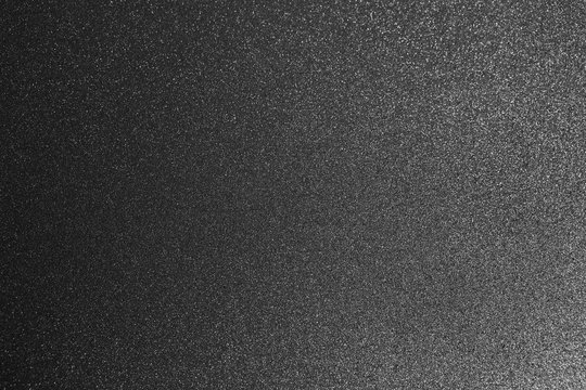 Closeup top view flatlay photography of dark grey abstract texture. 