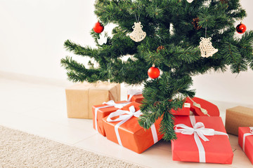 Christmas gift boxes and fir tree, top view
