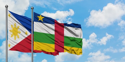 Philippines and Central African Republic flag waving in the wind against white cloudy blue sky together. Diplomacy concept, international relations.