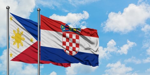 Philippines and Croatia flag waving in the wind against white cloudy blue sky together. Diplomacy concept, international relations.
