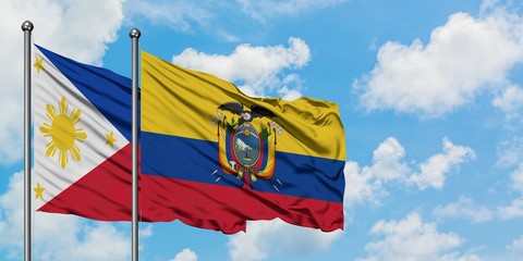 Philippines and Ecuador flag waving in the wind against white cloudy blue sky together. Diplomacy concept, international relations.