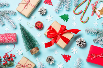 Christmas flat lay background with decorations on blue.