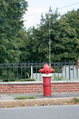 Naklejka premium FIRE HYDRANT with an arrester in a residential area painted in red and white colors