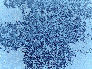 Cold pattern on a dark background. Combination of large and small elements of the picture. Winter frost concept.