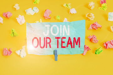 Conceptual hand writing showing Join Our Team. Concept meaning inviting someone to join in your local group or company Colored crumpled paper empty reminder white floor clothespin