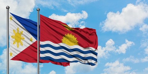 Philippines and Kiribati flag waving in the wind against white cloudy blue sky together. Diplomacy concept, international relations.