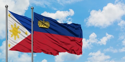 Philippines and Liechtenstein flag waving in the wind against white cloudy blue sky together....