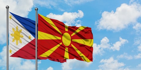 Philippines and Macedonia flag waving in the wind against white cloudy blue sky together. Diplomacy concept, international relations.