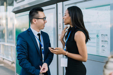 Stylish business colleague talking on station