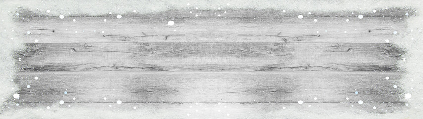 winter background - frame made of snow and snowflakes on bright light white grey rustic grunge...