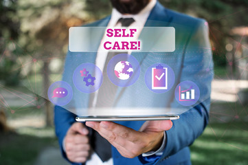 Writing note showing Self Care. Business concept for the practice of taking action to improve one s...