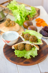 Falafel with lettuce and vegetables in pita bread.