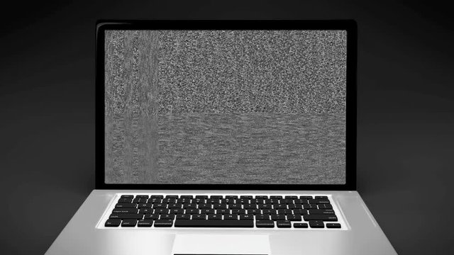 Laptop portable computer screen, black and white analog tv static screen