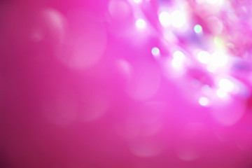 Elegant pink and purple abstract background with bokeh lights. Copyspace.