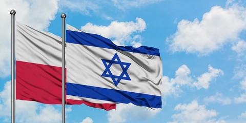 Poland and Israel flag waving in the wind against white cloudy blue sky together. Diplomacy concept, international relations.