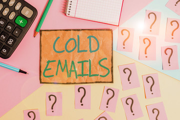 Writing note showing Cold Emails. Business concept for unsolicited email sent to a receiver without prior contact Mathematics stuff and writing equipment above pastel colours background