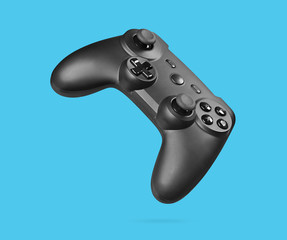 game controller isolated on blue background © spaxiax