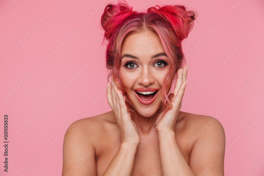 Wall mural Portrait of amazed shirtless young woman with colorful hairstyle laughing