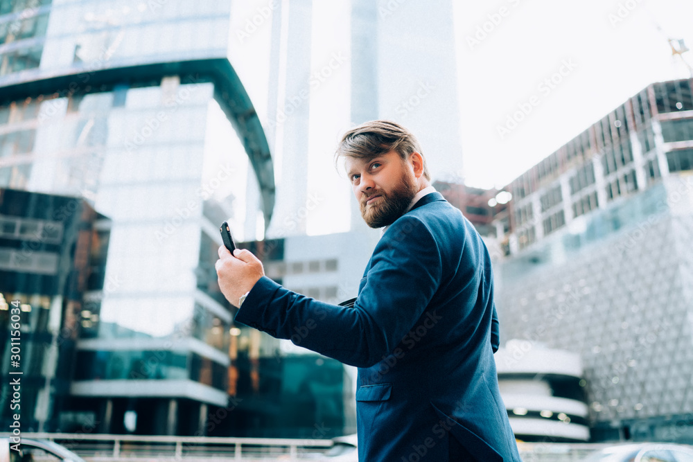 Poster puzzled businessman pondering on received text message via cellphone device connected to enterprise 
