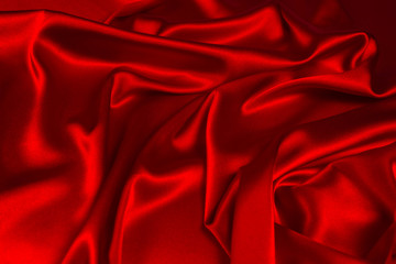 Obraz premium Red silk or satin luxury fabric texture can use as abstract background. Top view.