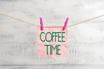 Conceptual hand writing showing Coffee Time. Concept meaning a short period of time in which you stop working to rest Clothespin rectangle shaped paper reminder white wood desk