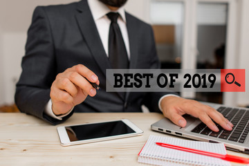 Conceptual hand writing showing Best Of 2019. Concept meaning great and marvelous things and events happened on 2019 Male human wear formal clothes present use hitech smartphone