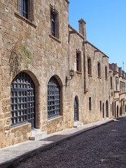 Fototapeta na wymiar view of the street of the knights of rhodes lined with medieval buildings and cobbled road