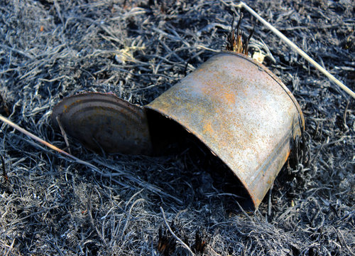  tin can on burnt ground