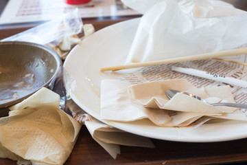 Fototapeta na wymiar chiba, japan, 11/04/2019 , Dirty dishes and napkins after a meal in a restaurant.