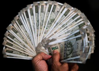 Male Hands full of money. Indian businessman got success & profit from business. Showing, holding...