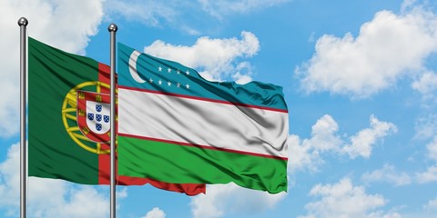 Portugal and Uzbekistan flag waving in the wind against white cloudy blue sky together. Diplomacy...