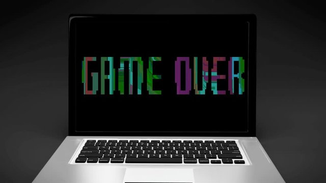 zoom on a laptop screen with words GAME OVER in pixels font