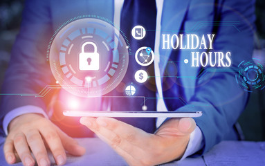 Writing note showing Holiday Hours. Business concept for employee receives twice their normal pay for all hours Picture photo network scheme with modern smart device