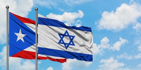 Puerto Rico and Israel flag waving in the wind against white cloudy blue sky together. Diplomacy concept, international relations.