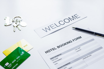 reservation form on hotel reception desk background
