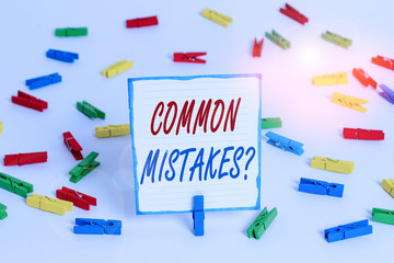 Handwriting text Common Mistakes Question. Conceptual photo repeat act or judgement misguided making something wrong Colored clothespin papers empty reminder white floor background office