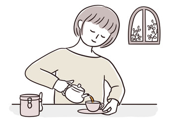 カップにお茶を注ぐ女性