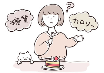 ケーキを食べようとして考える女性