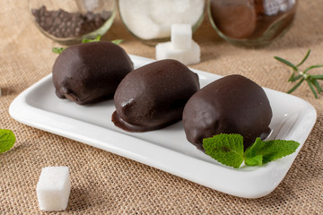 Traditional Russian cake potato chocolate truffle biscuit.  Vanilla cookies with cocoa powder, cream and nuts. Served on selenium napkins. Unroasted biscuit dough.