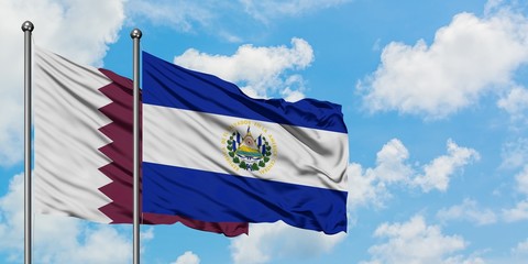 Qatar and El Salvador flag waving in the wind against white cloudy blue sky together. Diplomacy concept, international relations.
