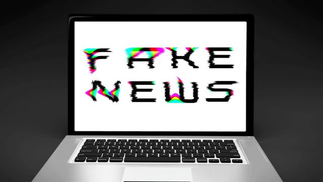FAKE NEWS screen on laptop computer portable, 3D pixel interferences font