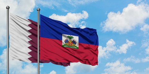 Qatar and Haiti flag waving in the wind against white cloudy blue sky together. Diplomacy concept,...