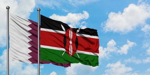 Qatar and Kenya flag waving in the wind against white cloudy blue sky together. Diplomacy concept,...