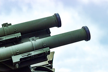 Military equipment. The barrel of a large-caliber gun. The barrel is directed to the right and up.
