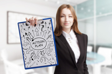 Business, technology, internet and network concept. Young businessman shows a keyword: Action plan