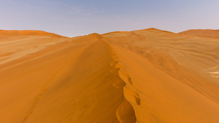 Fototapeta na wymiar Approaching Deadvlei and Sossusvlei from the ridge of the dunes, Namibia