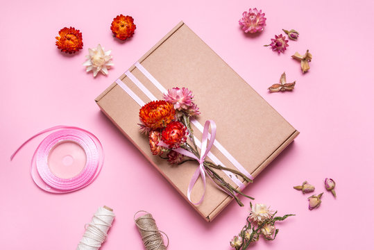 Cardboard Gift Box Decorated With Dried Flowers On Pink Background